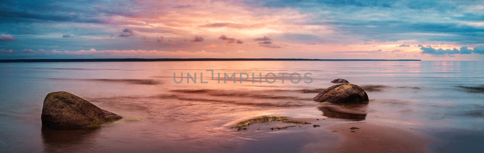 Rocky shores at the sea in sunset light. Lahemaa natural park coastal landscape with beautiful sky