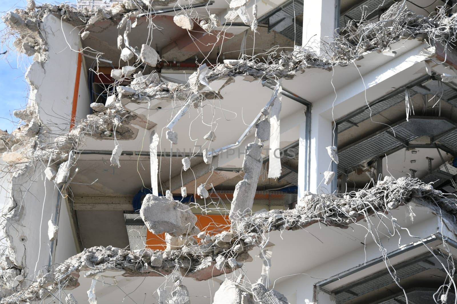 Close-up of a high-rise building that is currently being demolished.