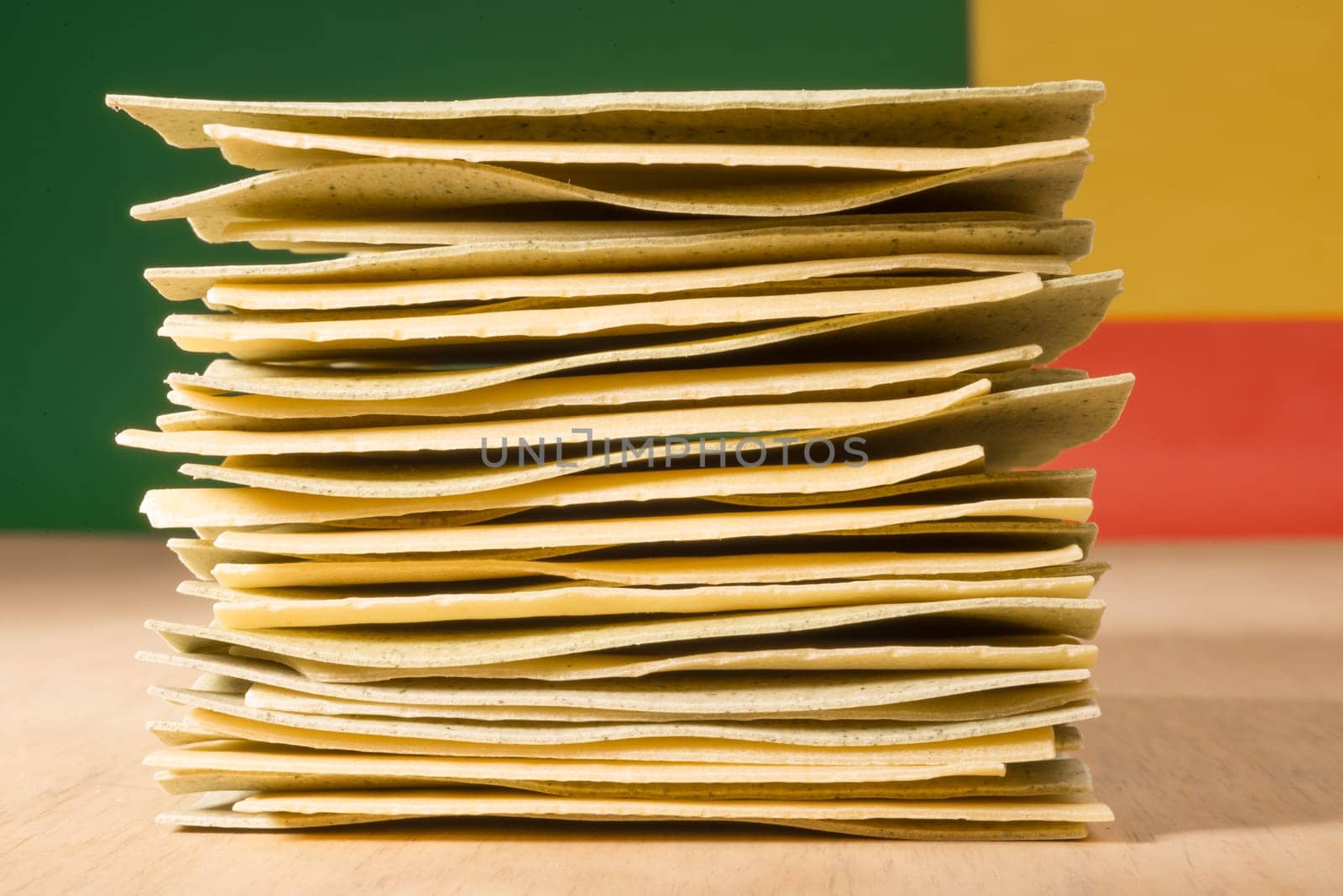 Uncooked pieces of lasagne stacked on top of each other.