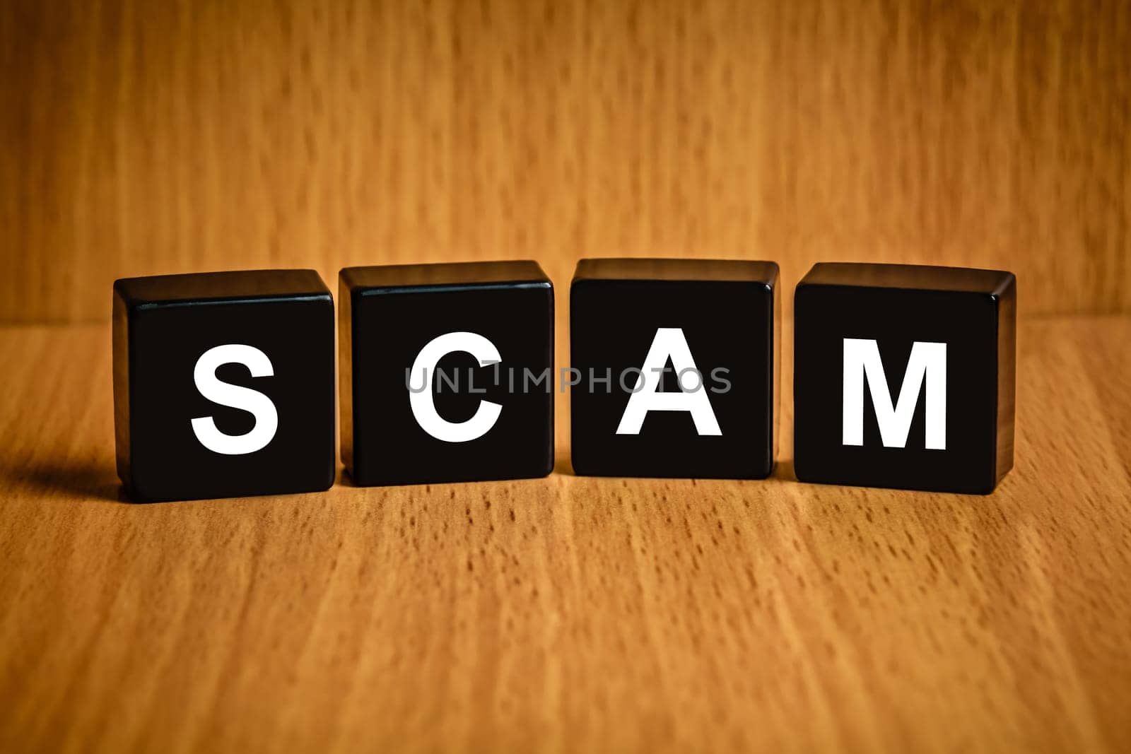 Scam, fraud text on black block, technology security concept