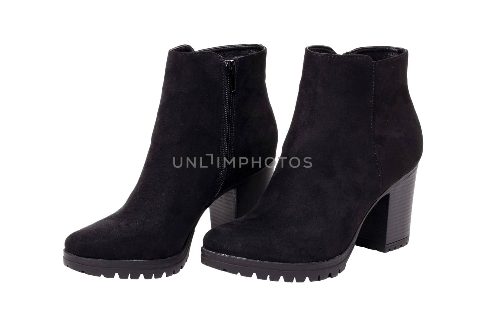 Leather shoes isolated. Close-up of a pair of black classic elegant female suede shoes isolated on a white background. Womans shoe fashion. Macro.