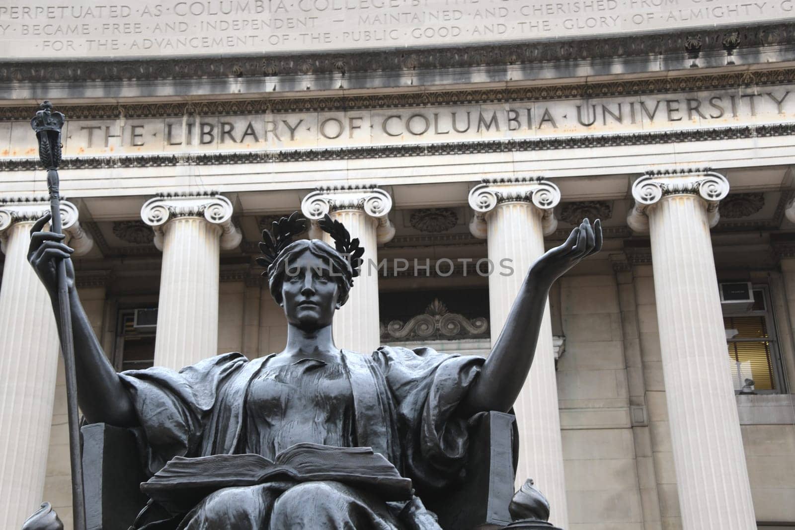 The bronze statue Alma Mater in front of the library of Columbia University in the borough of Morningside Hights - Manhattan. New York.