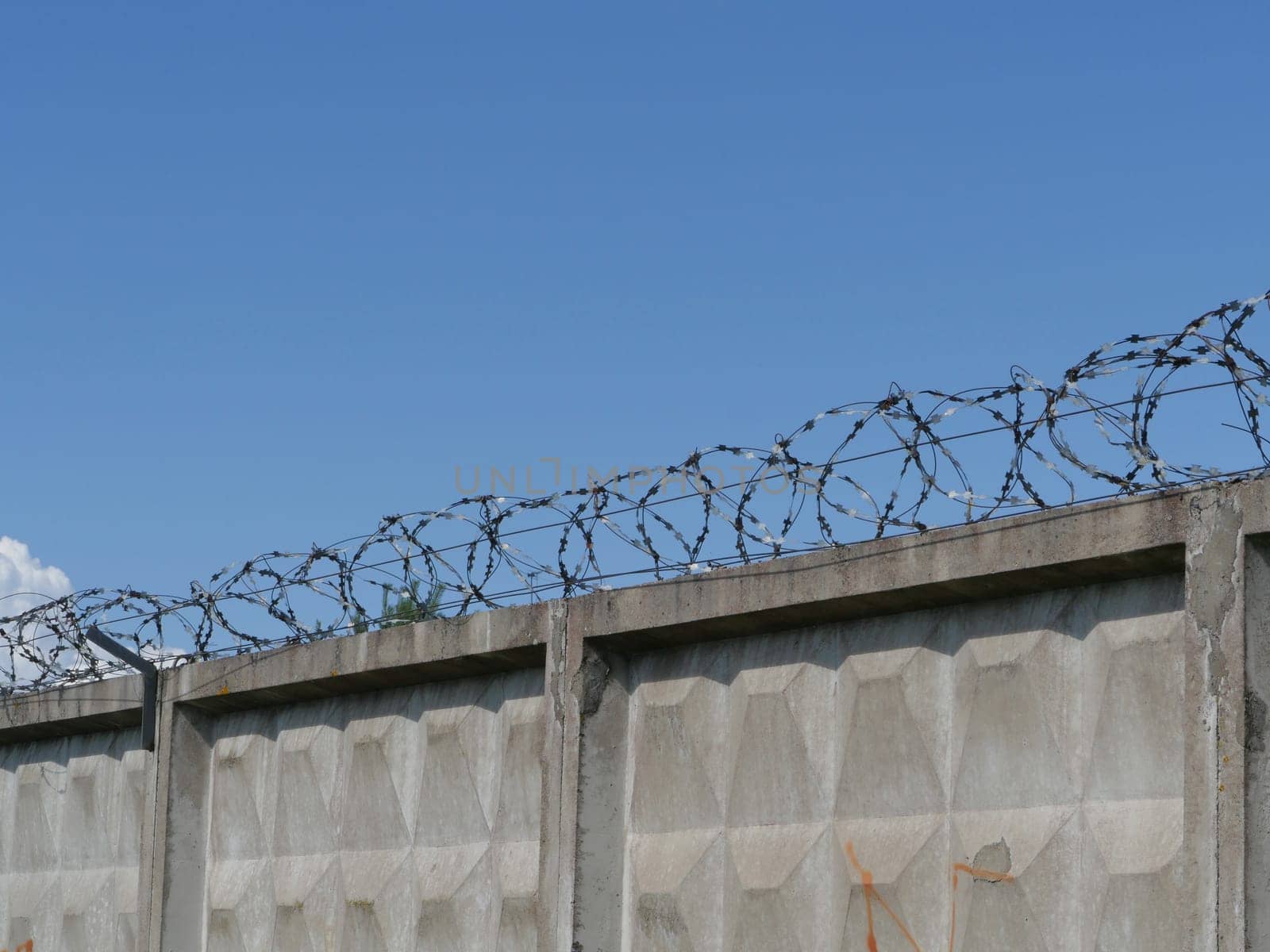 high fence with barbed wire restricted area concept
