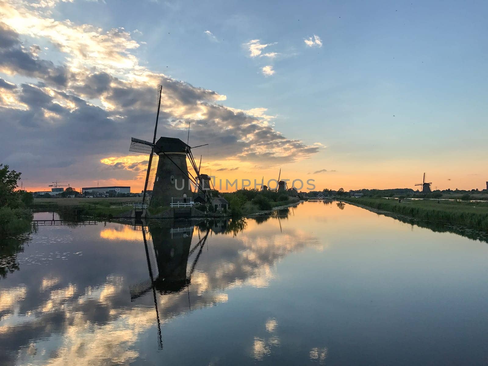 Beautiful dutch windmill landscape at the famous Kinderdijk canals, UNESCO world heritage site