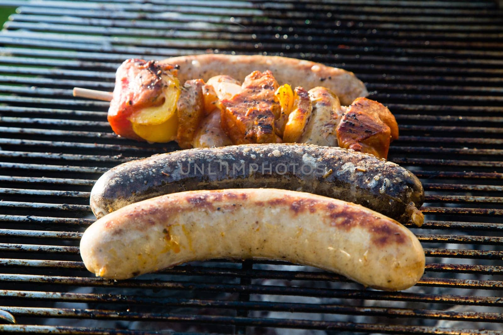 Grilled meat on a summer barbecue in the garden