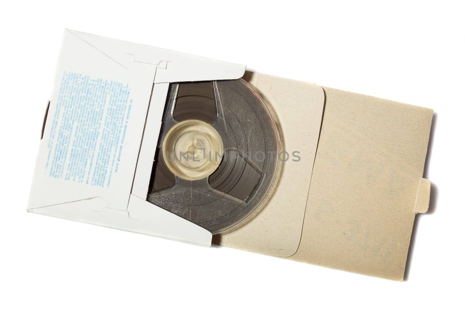Retro reel to reel tape in a carton box on white background