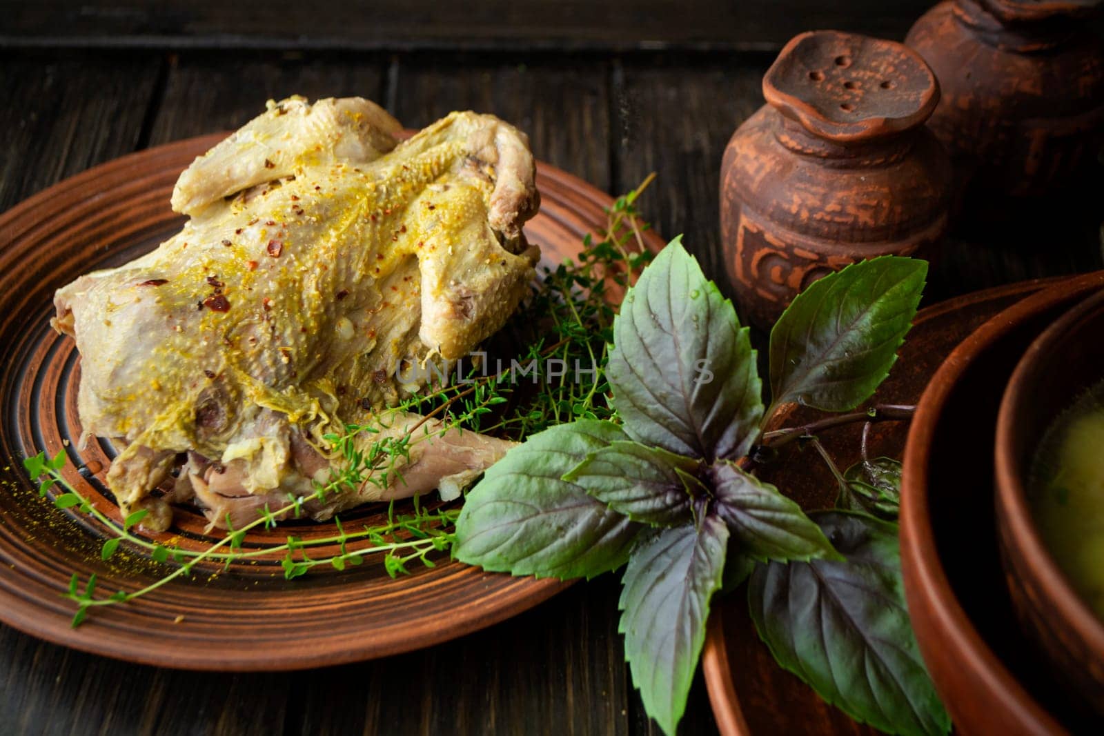roast wild partridge plated meal on rustic table and brown plate