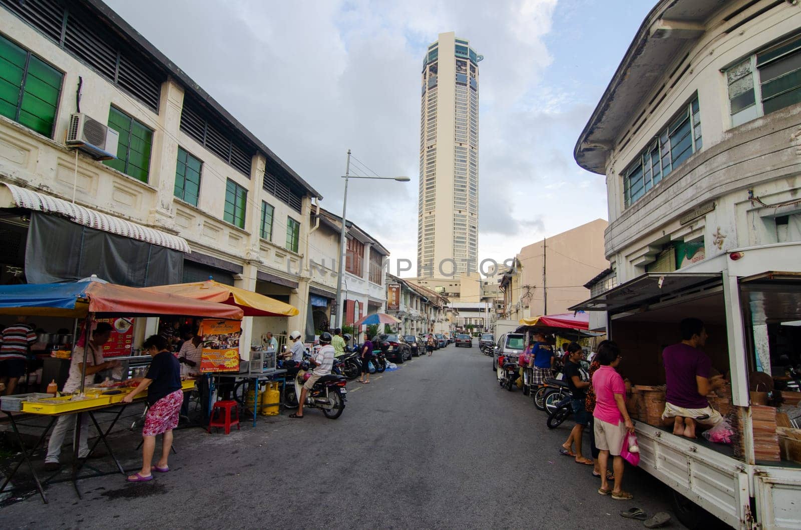Georgetown, Penang/Malaysia - Jul 31 2016: Penang street stall and KOMTAR building at background.