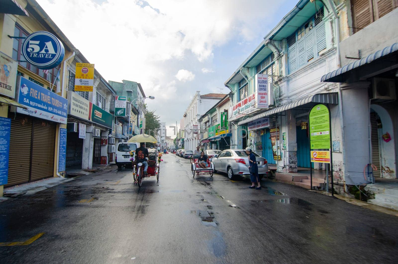 Georgetown, Penang/Malaysia - Jul 31 2016: Trishaw driver at Chulia street.