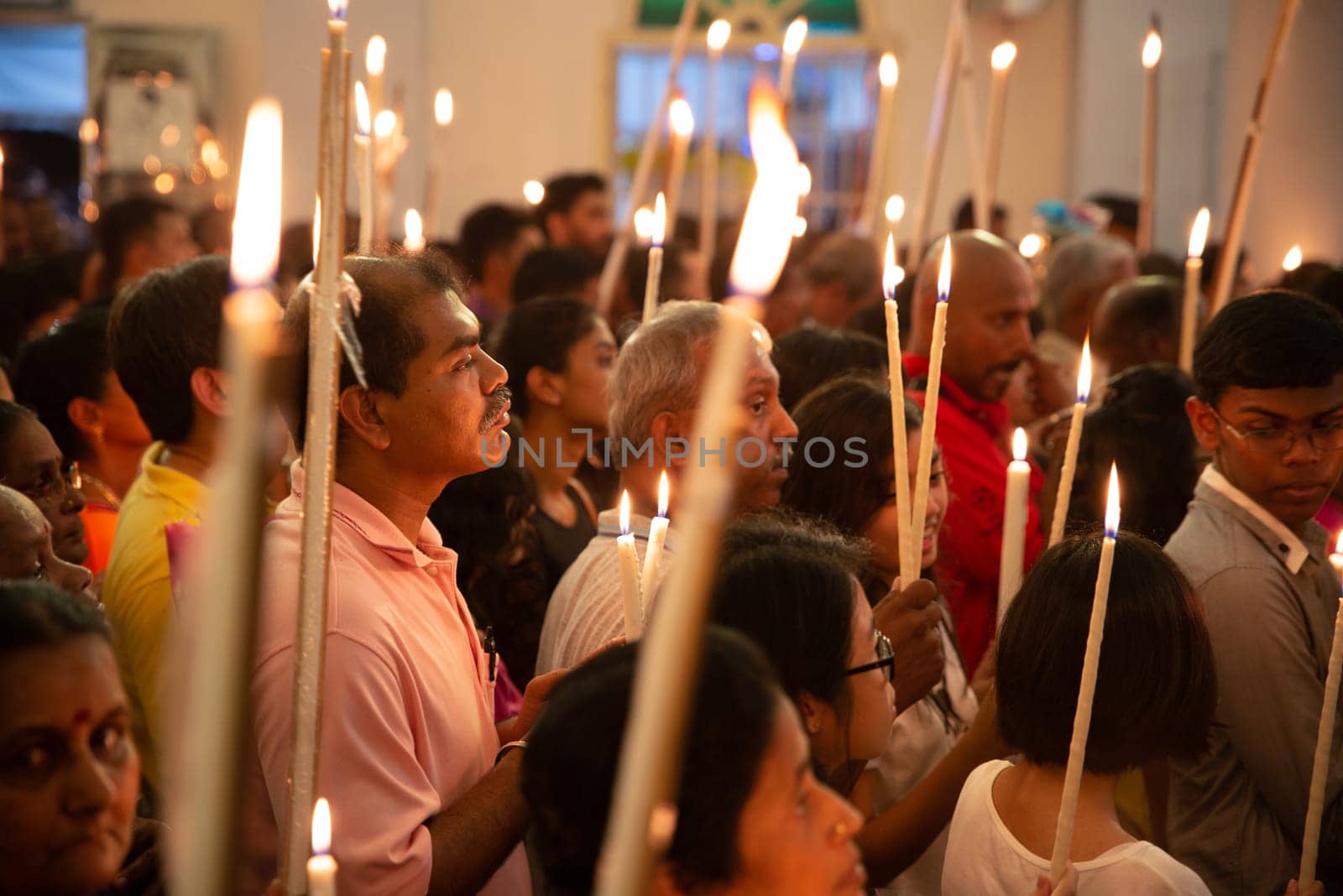 Bukit Mertajam, Penang/Malaysia - Jul 30 2016: Prayer with candles during St Anne feast in church.