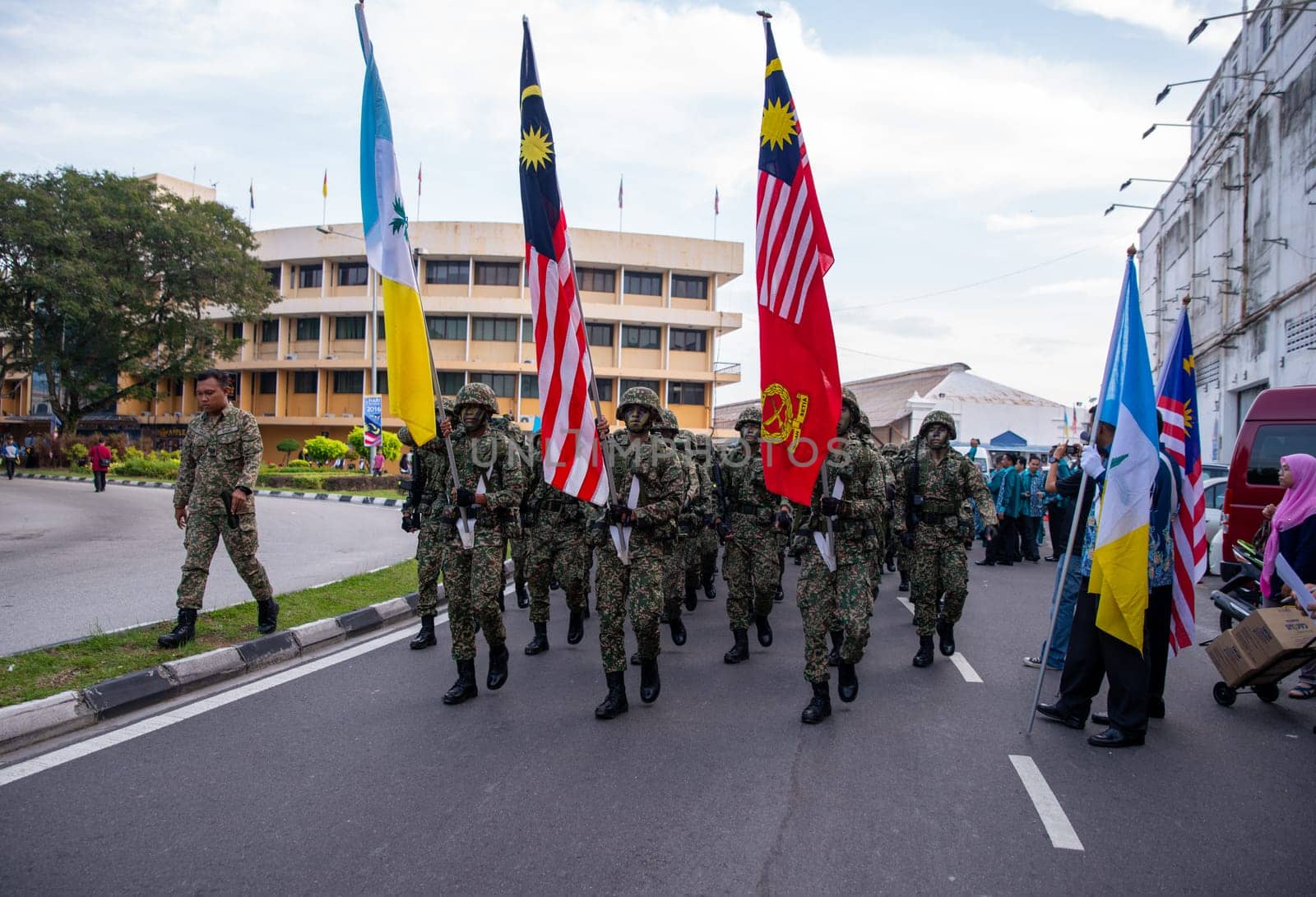 Georgetown, Penang/Malaysia - Aug 31 2016: Soldier hold the Malaysia flag during merdeka procession.