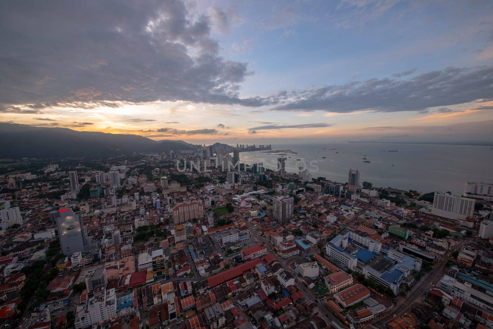 George Town, Penang/Malaysia - Jun 18 2017: Aerial view Georgetown with shops, old houses, apartment during sunset.