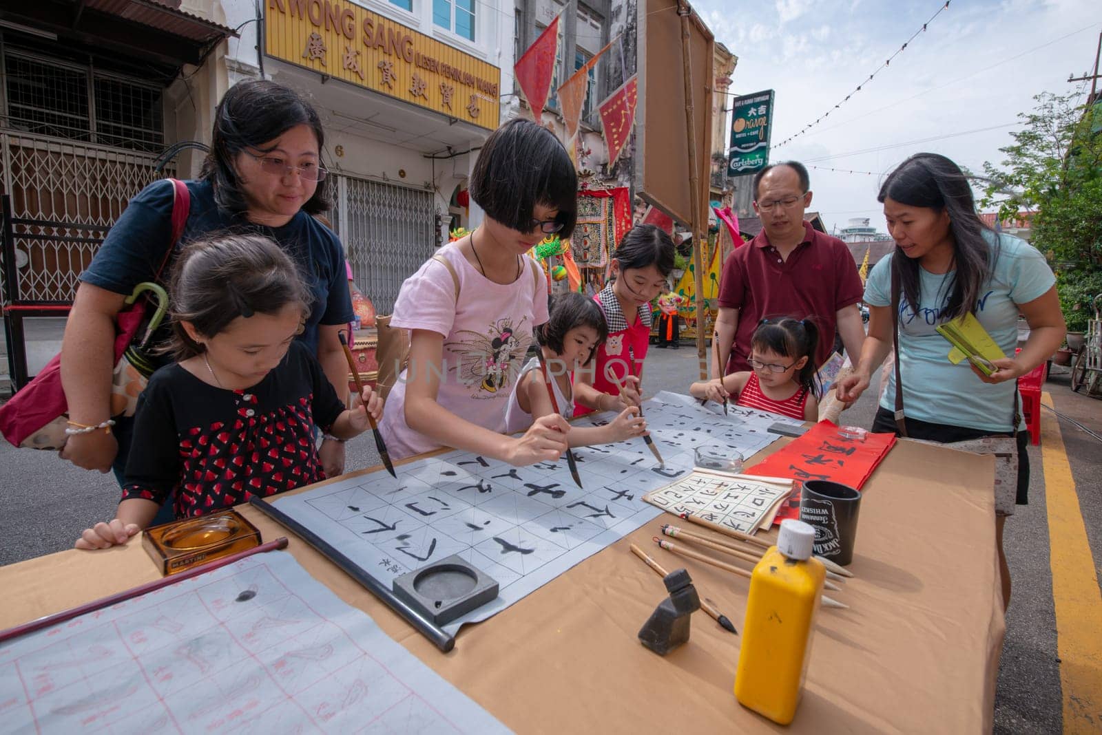 George Town, Penang/Malaysia - Jul 07 2017: Local learn chinese calligraphy at street during Georgetown Heritage day.
