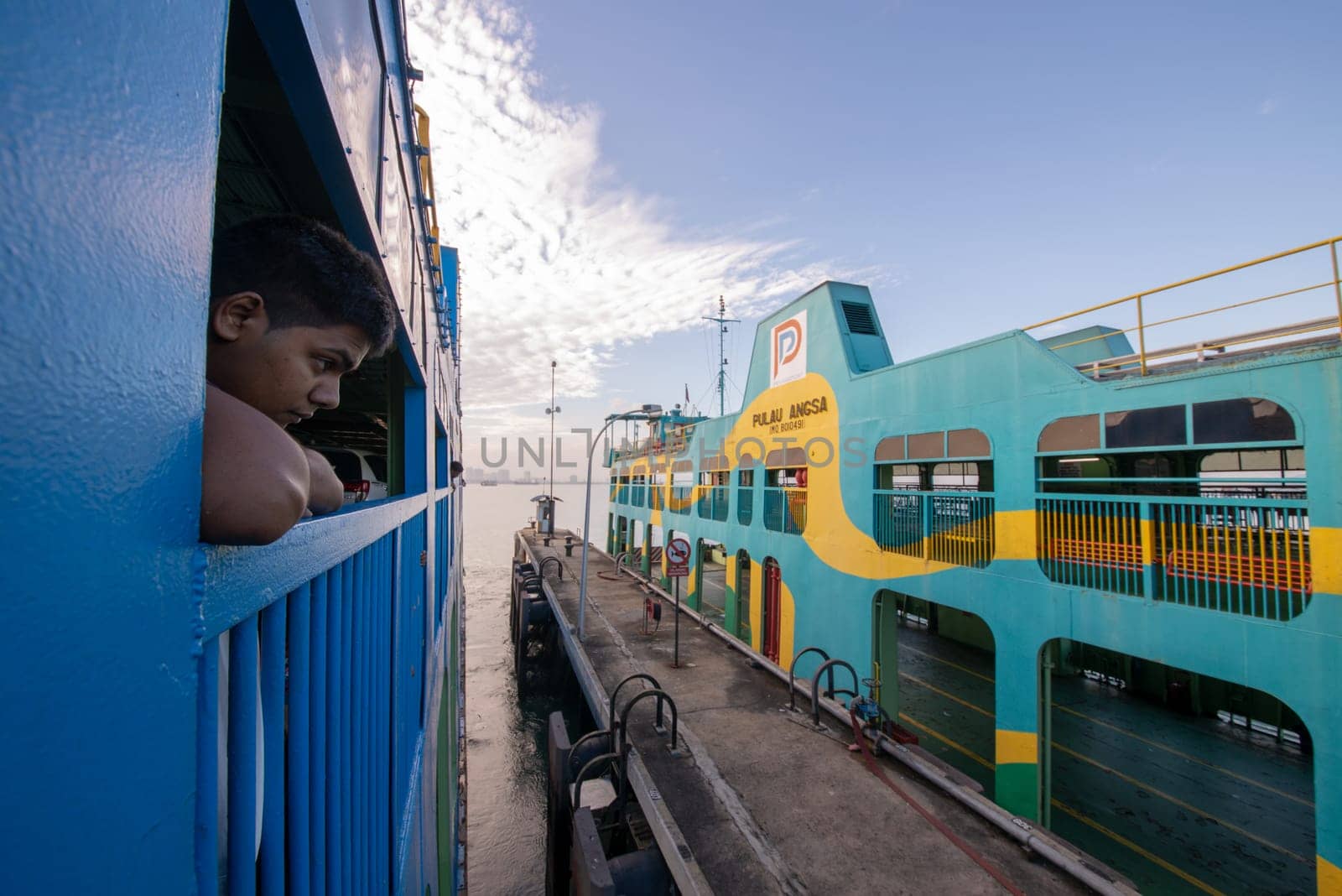 George Town, Penang/Malaysia - Jun 27 2017: A boy view the scenery at ferry.