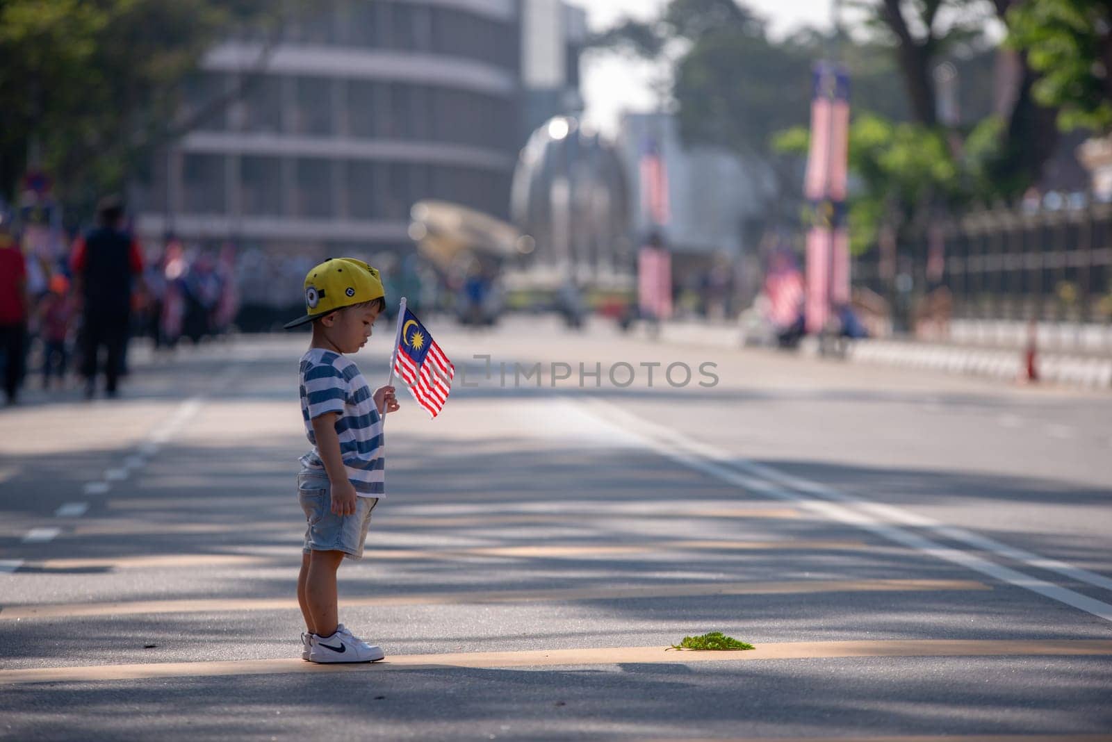 George Town, Penang/Malaysia - Aug 31 2017: A kid hold Malaysia flag.