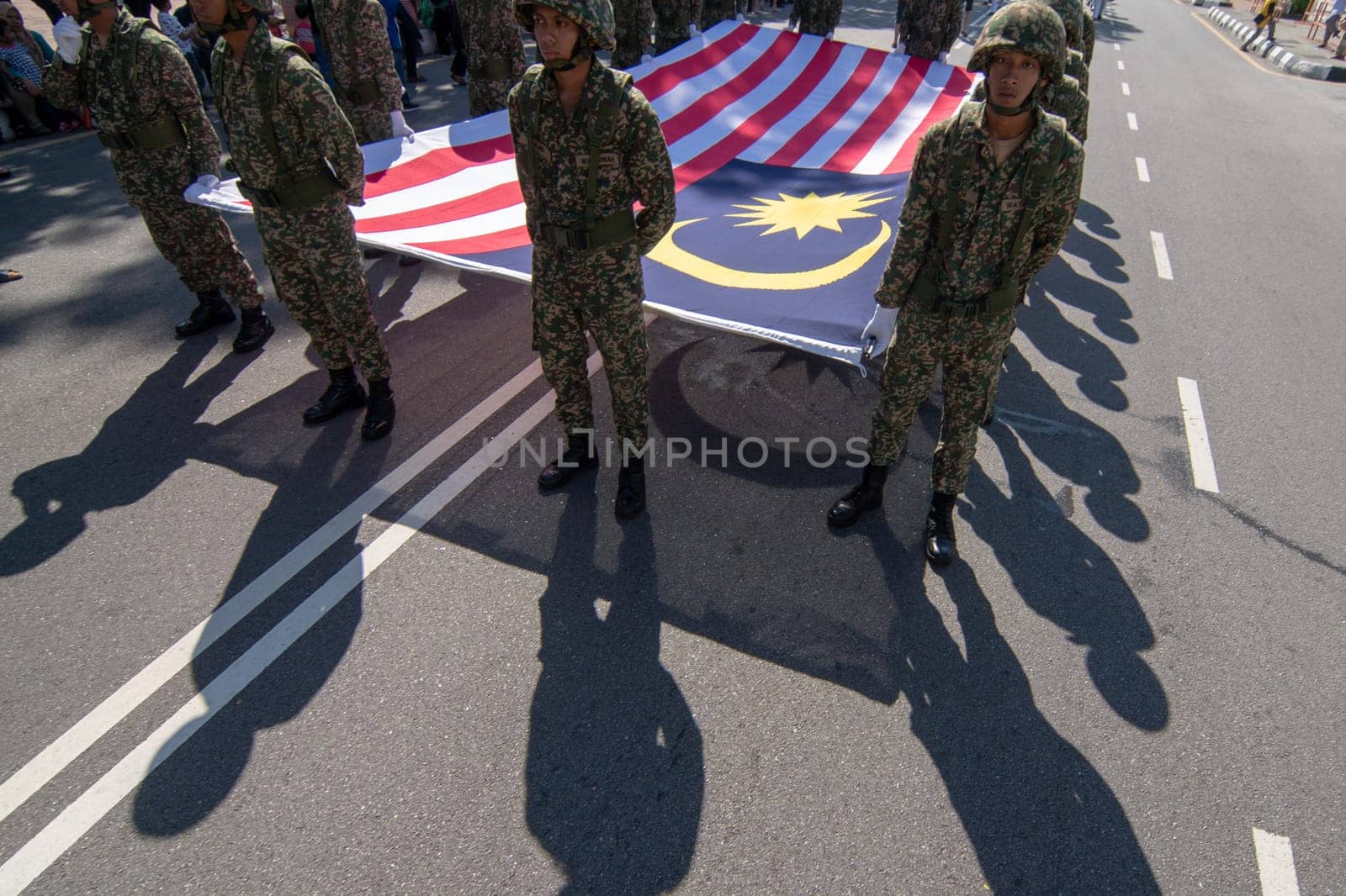 George Town, Penang/Malaysia - Aug 31 2017: Soldier carry large Malaysia flag at parade.
