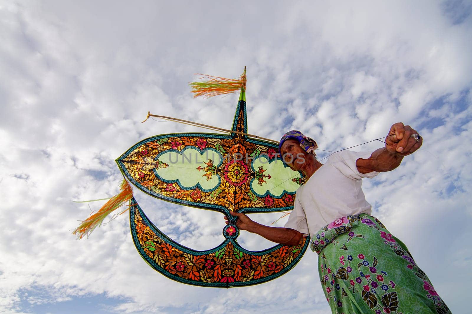 Kota Bahru, Kelantan/Malaysia - Jul 15 2017: A man play his moon kite at outdoor.