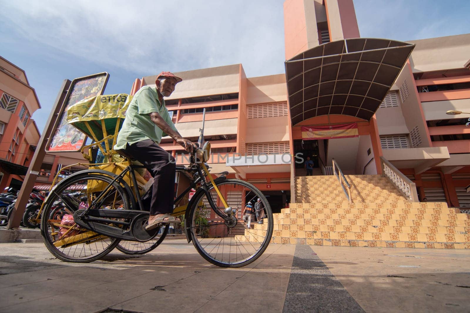 Kota Bahru, Kelantan/Malaysia - Jul 15 2017: A man cycle to pasar Siti Khdijah.