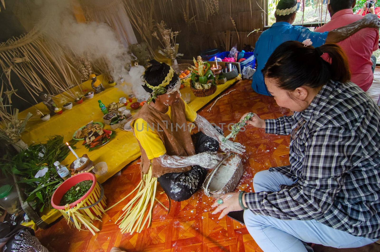 Carey Island, Selangor/Malaysia - Mar 17 2018: Malaysia aborigine Mah Meri with mask at oil palm estate,Malaysia aborigine Mah Meri cultural ritual in wooden house.