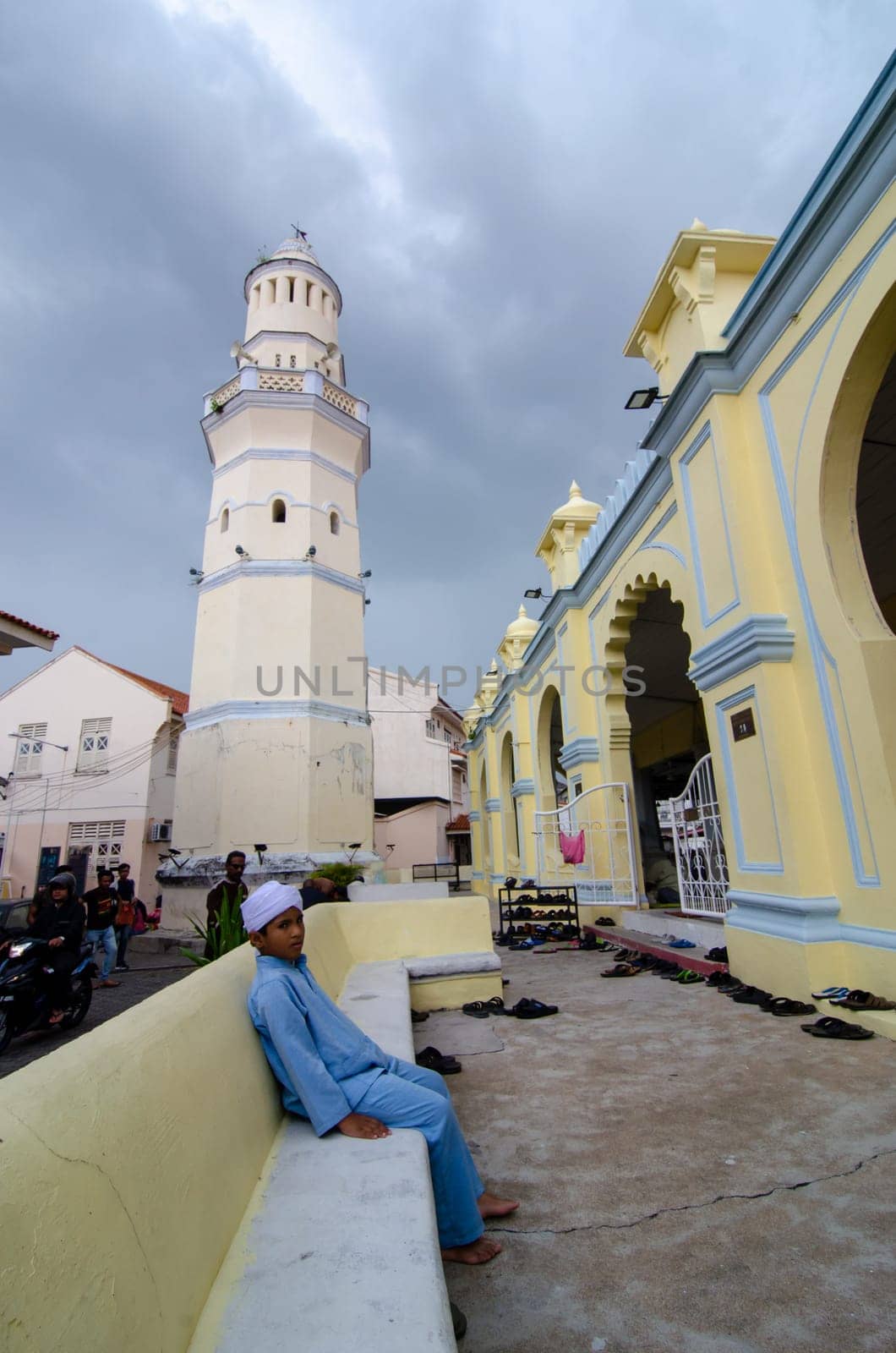 George Town, Penang/Malaysia - Jul 19 2018: Muslim kid sit outside Acheh Mosque.