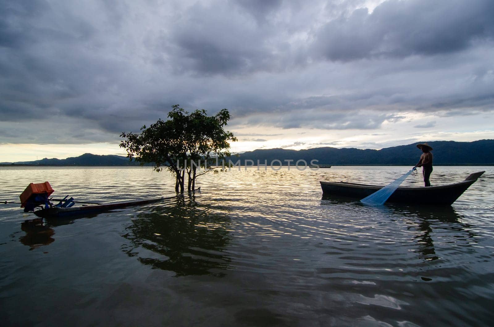 Timah Lake Tasoh, Perlis/Malaysia - Oct 24 2018: A fisherman catch fish at Timah Tasoh Lake.