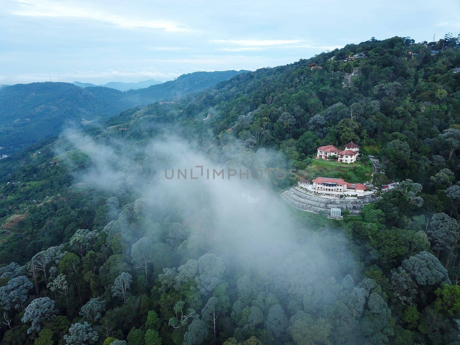 Georgetown, Penang/Malaysia - Jun 07 2019: Morning fog cloud over the bungalow at Penang Hill.