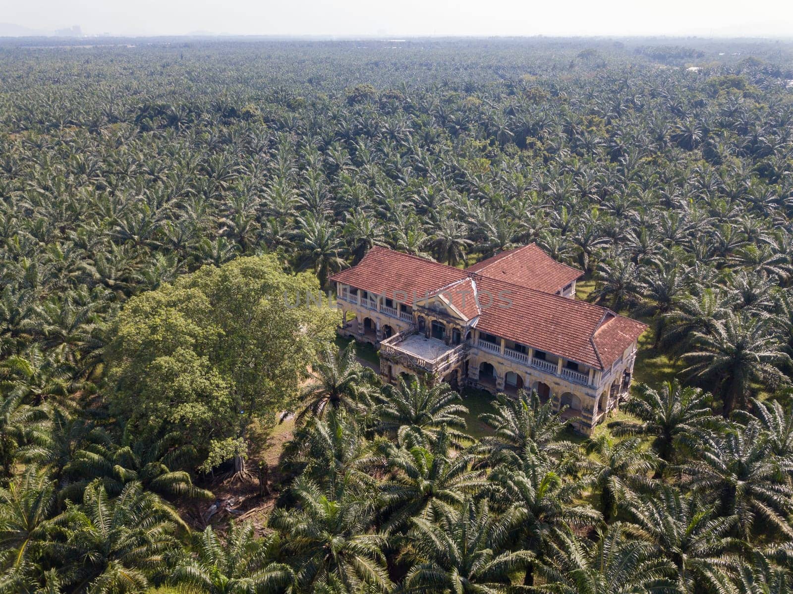 Nibong Tebal, Penang/Malaysia - Jun 27 2019: Aerial view abandoned 99 doors mansion in evening.