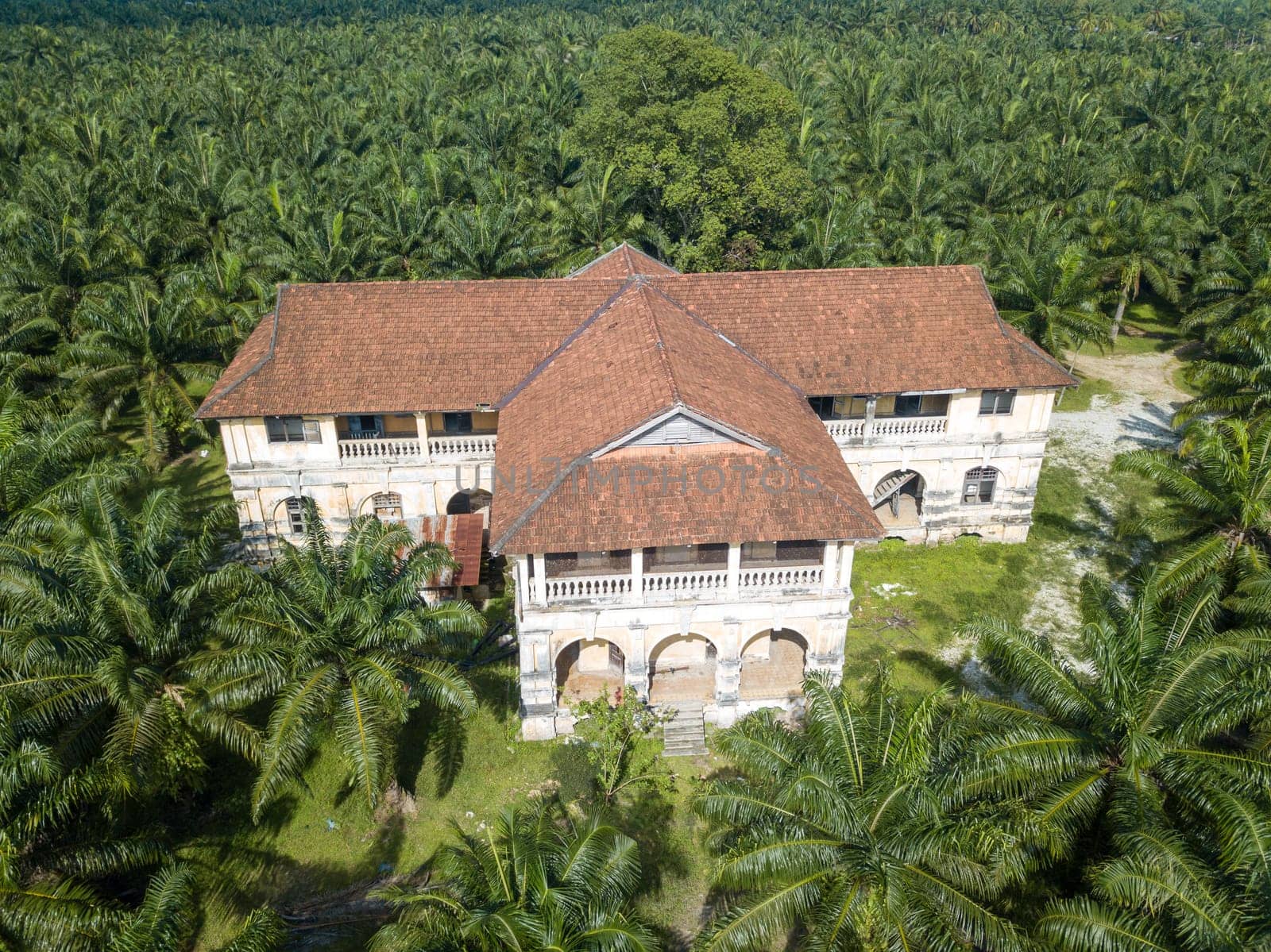 Nibong Tebal, Penang/Malaysia - Jun 27 2019: Aerial view 99 doors mansion at oil palm estate.