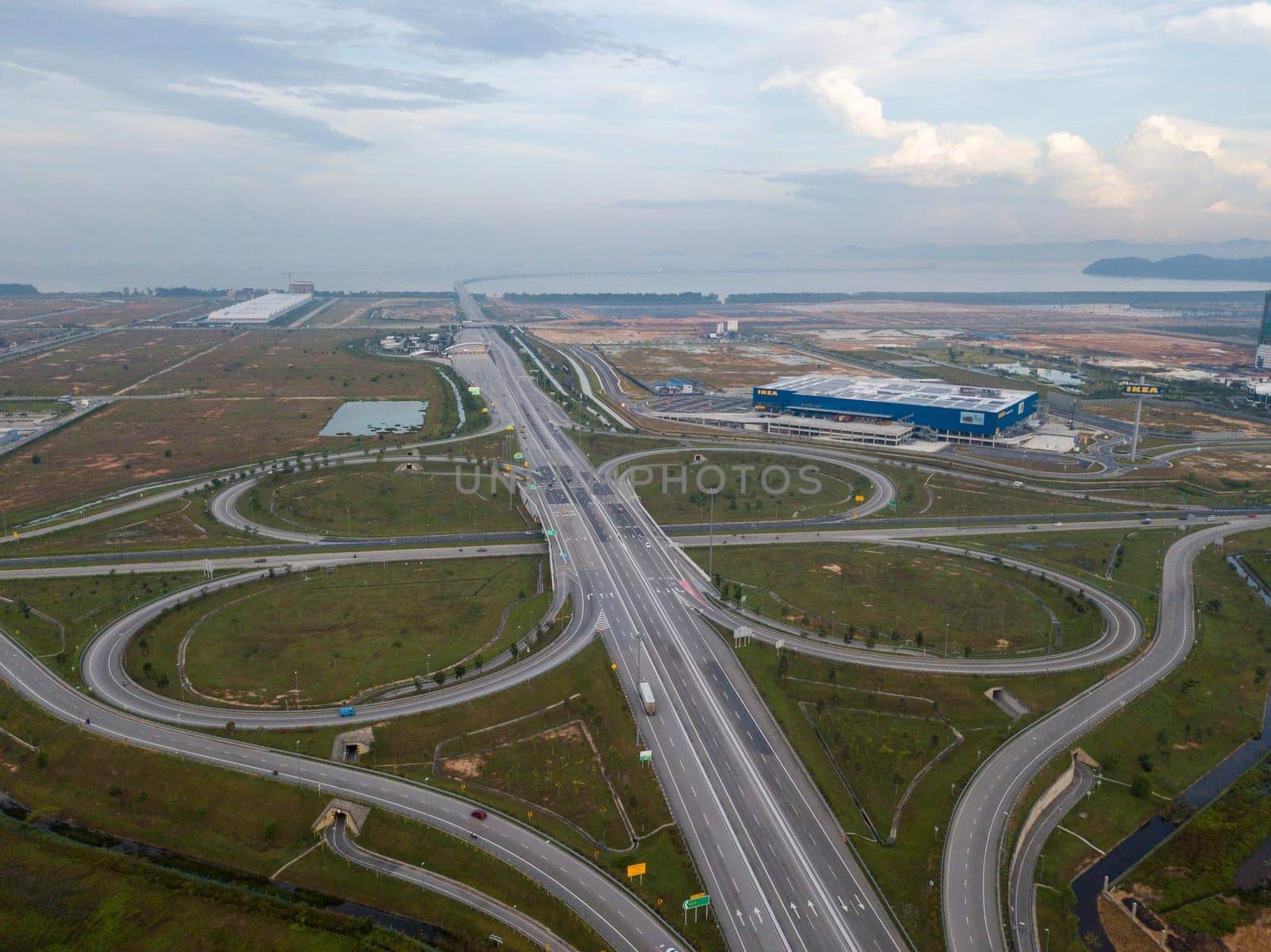 Batu Kawan, Penang/Malaysia - Aug 27 2019: Freeway cloverleaf interchange at Batu Kawan. IKEA building as background.