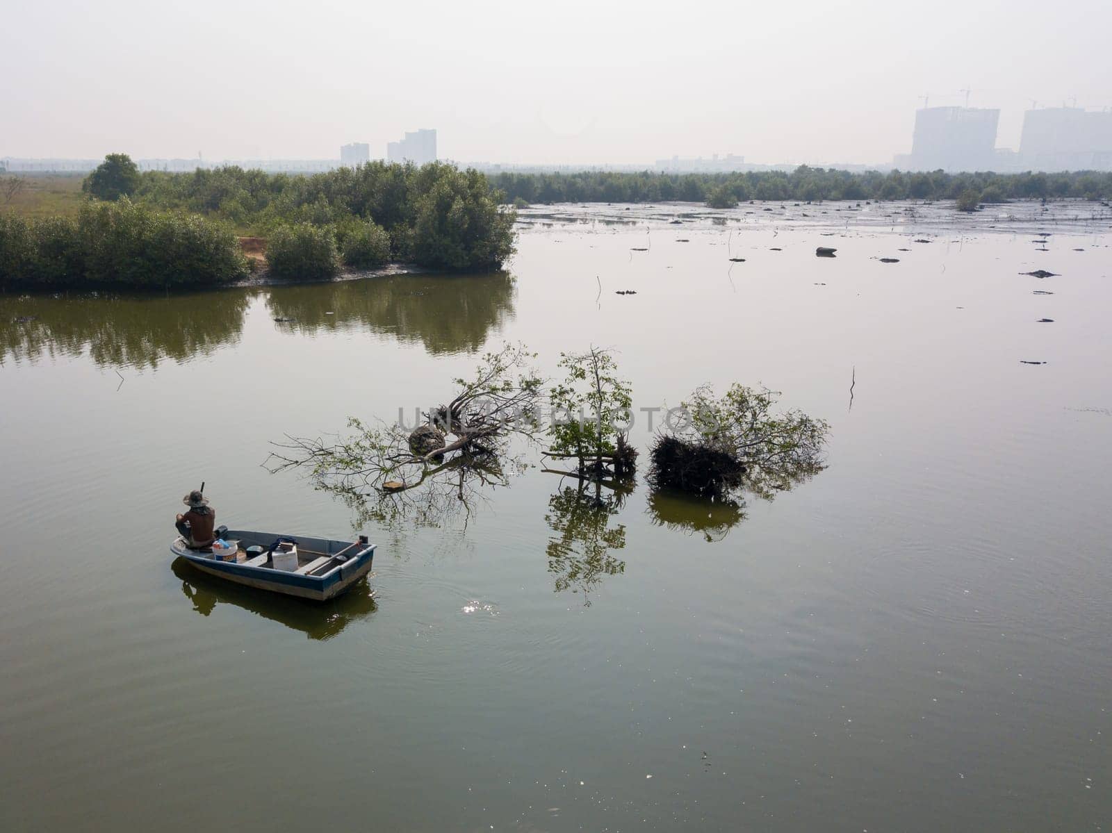 Batu Kawan, Penang/Malaysia - Sep 24 2019: Fisherman relax on boat.