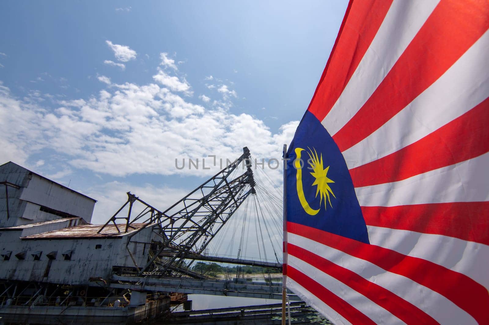 Tanjung Tualang, Perak/Malaysia - Oct 07 2019: Malaysia flag waving at Tanjung Tualang Tin Dredge.