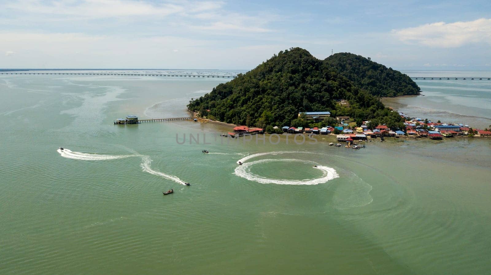 Pulau Aman, Penang/Malaysia - Oct 19 2019: Aerial fishing boat move at Pulau Aman.