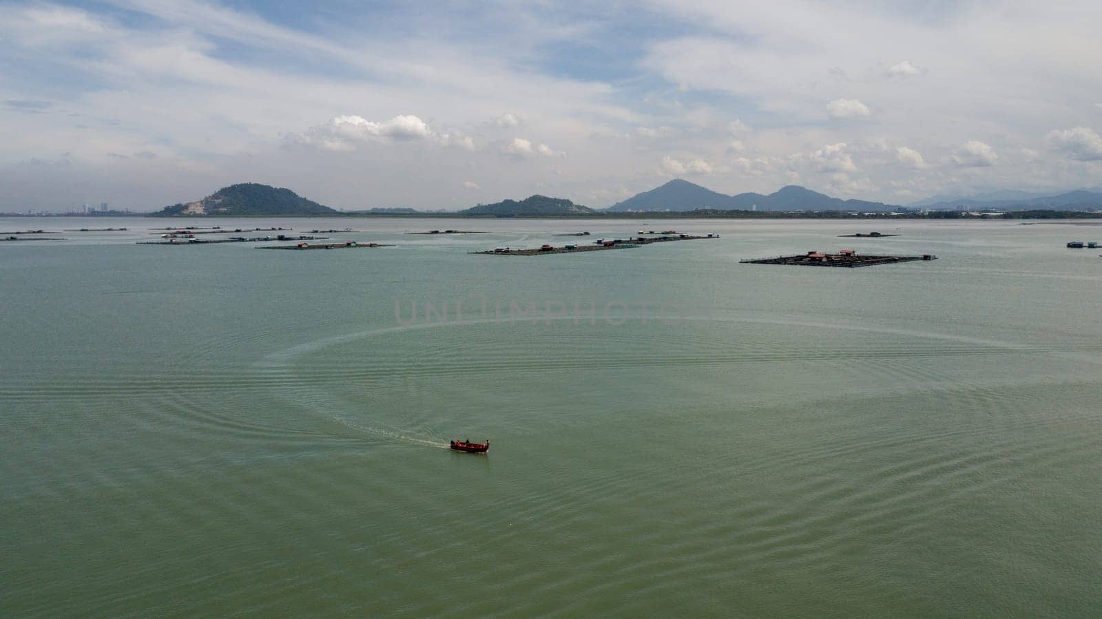 Pulau Aman, Penang/Malaysia - Oct 19 2019: Fishing boat move at fishing farm.