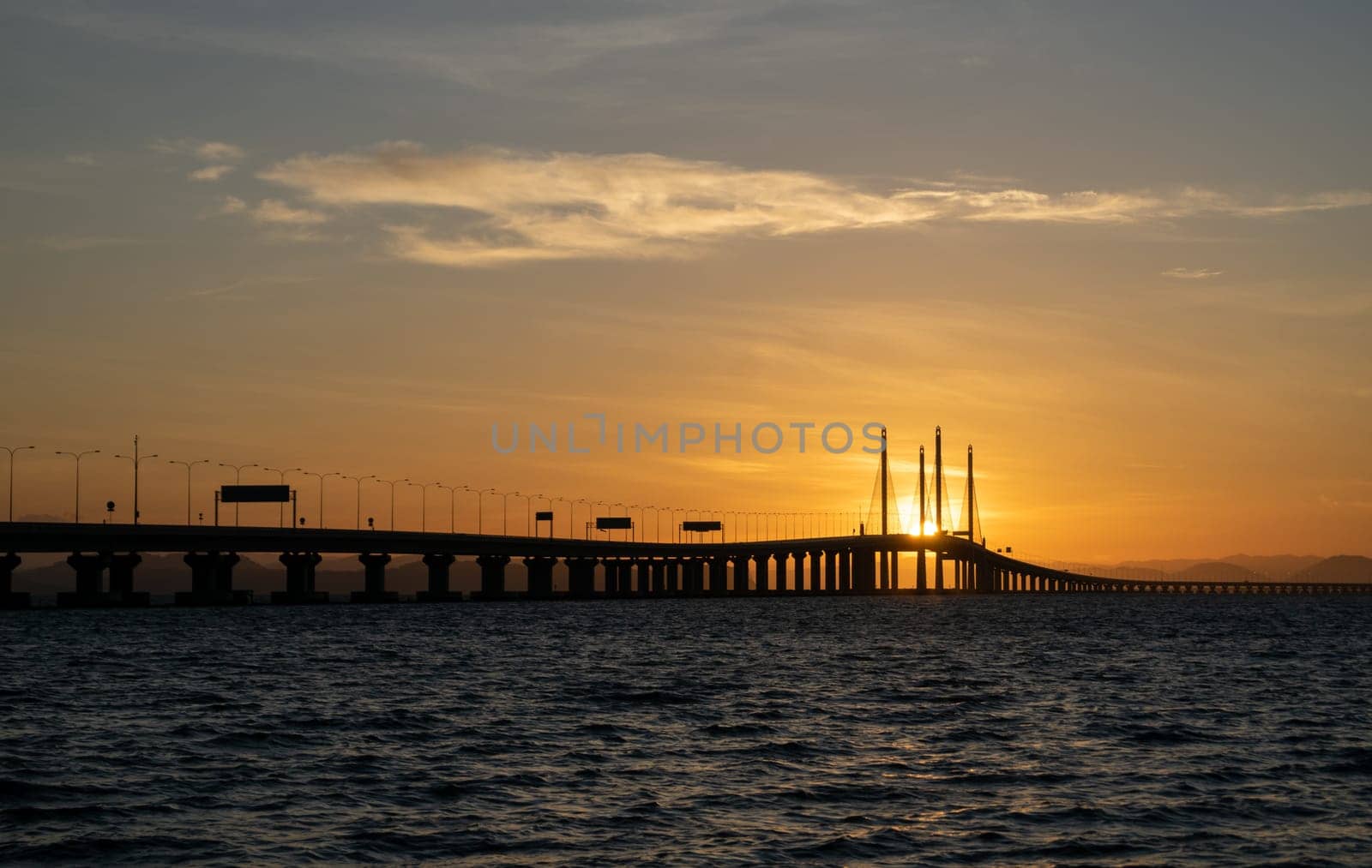 Batu Maung, Penang/Malaysia - Jan 01 2020: Penang second bridge in golden sun flare.