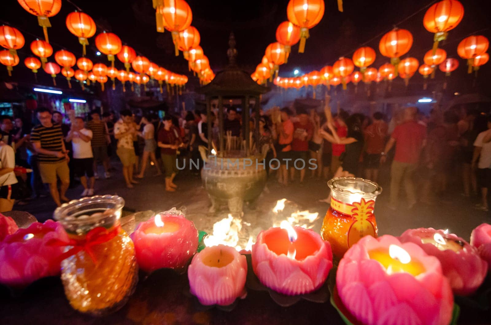 Georgetown, Penang/Malaysia - Jan 24 2020: People pray with joss stick and candle.