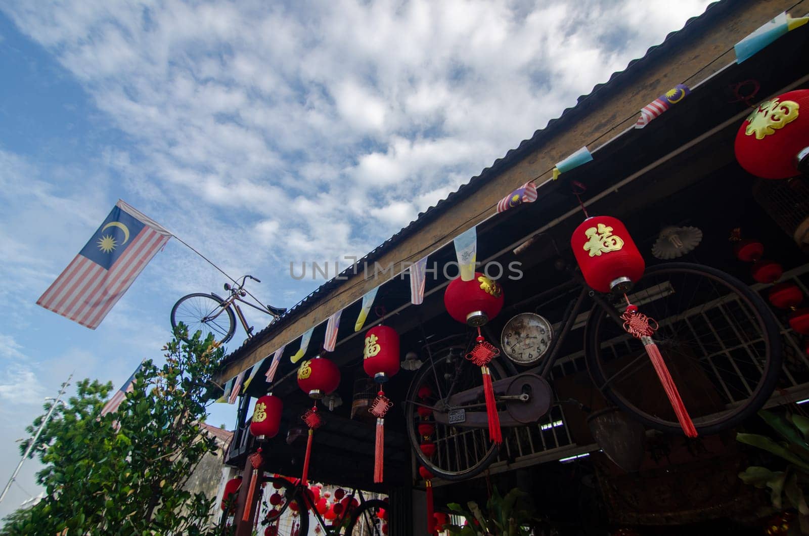 Georgetown, Penang/Malaysia - Feb 14 2020: Malaysia flag decorated at bicycle at rooftop.