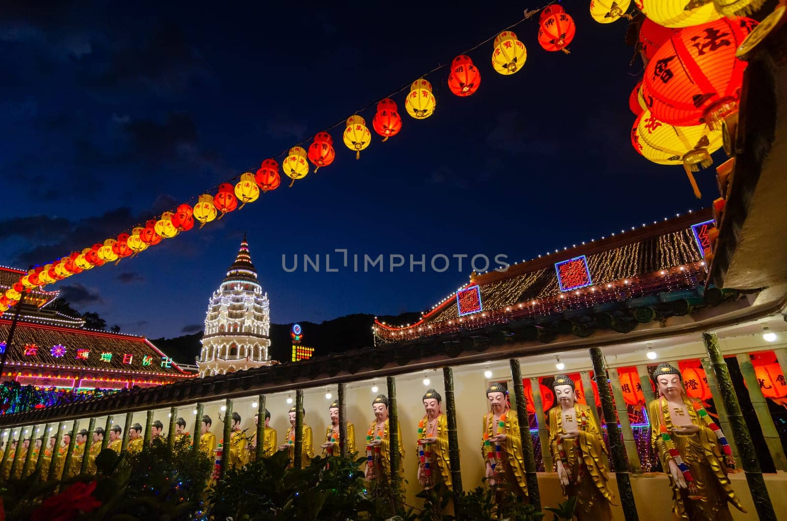 Georgetown, Penang/Malaysia - Feb 20 2020: Buddha statue and pagoda during blue hour.