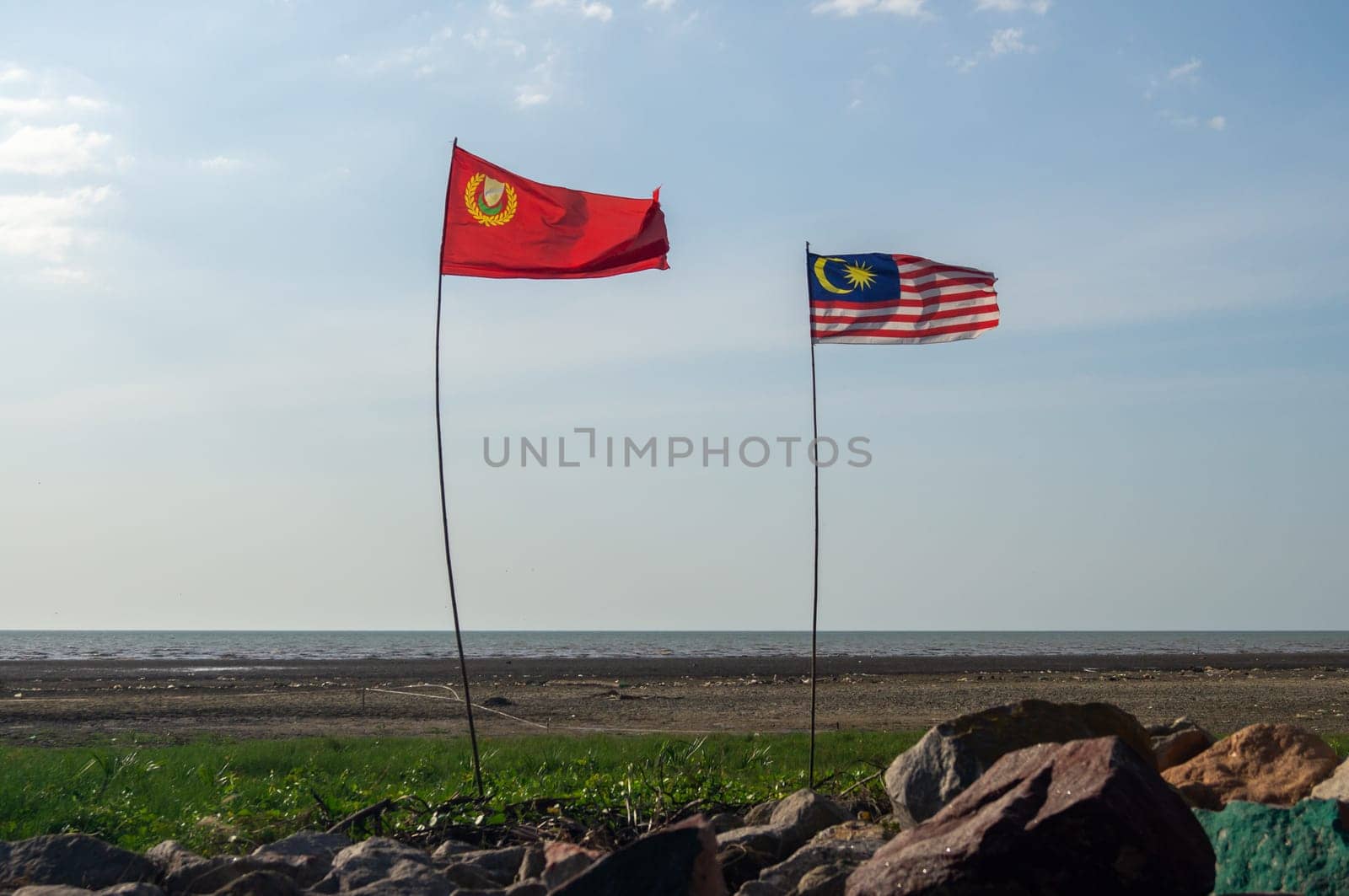 Pulau Sayak, Kedah/Malaysia - Feb 26 2020: Malaysia and Kedah flag waving near outdoor.