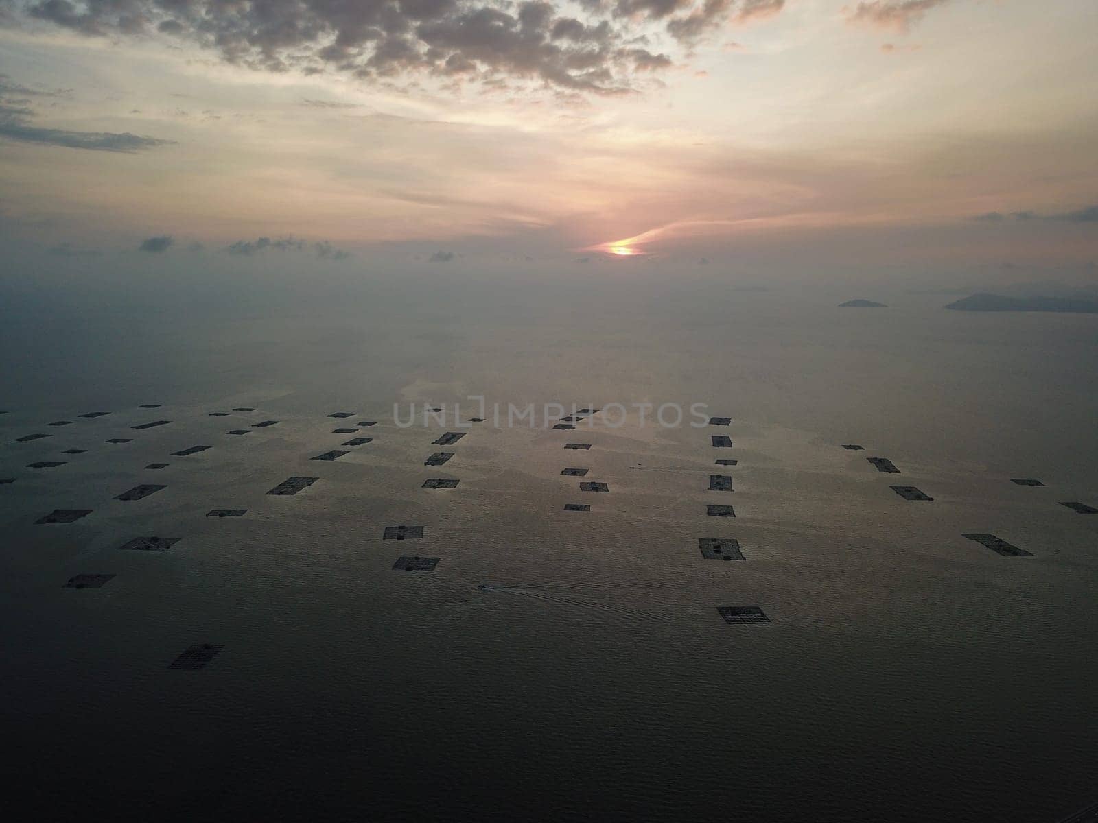 Batu Kawan, Penang/Malaysia - Feb 27 2020: Aerial view fish farm in magnificent sunset hour.