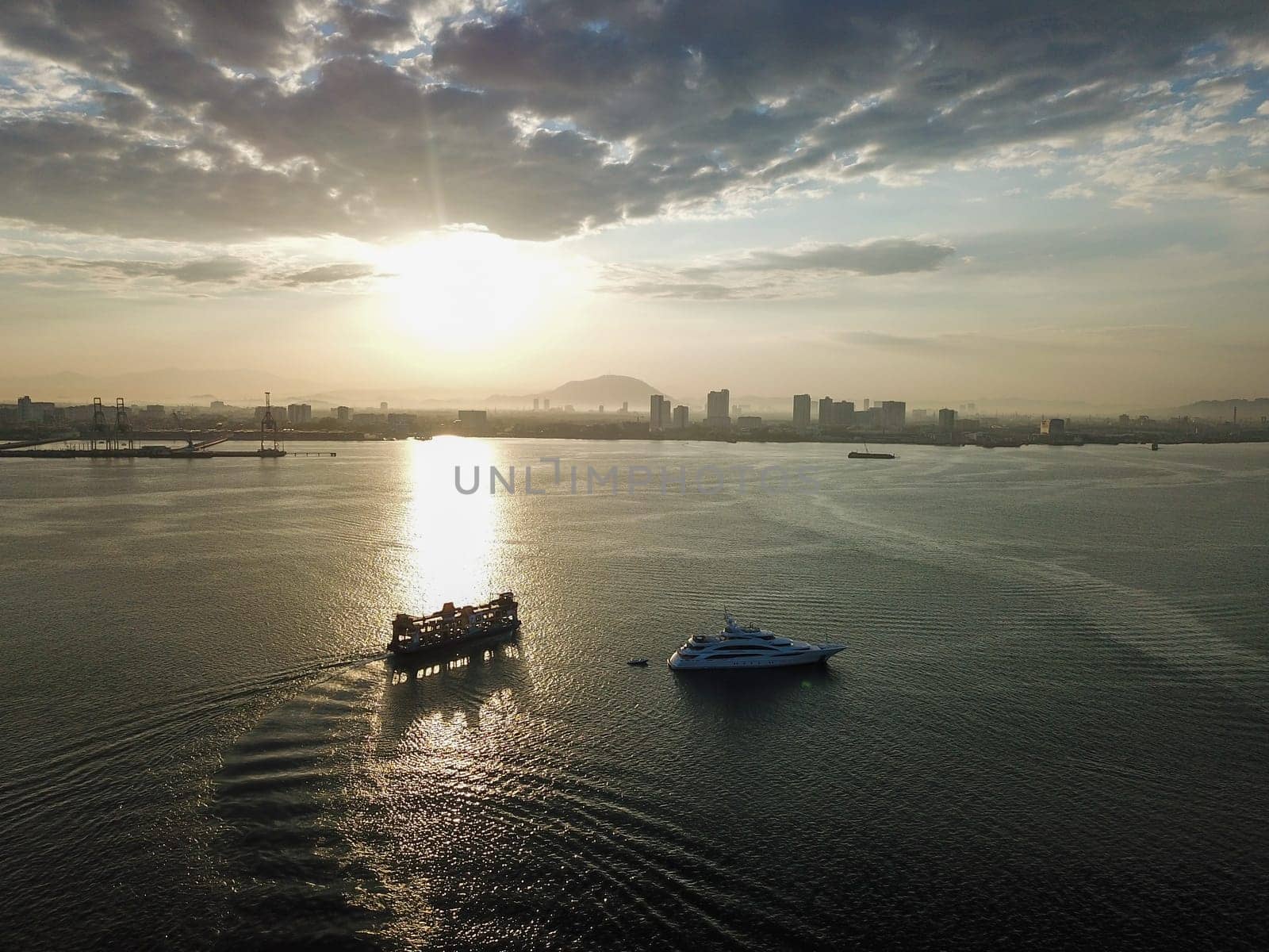 Georgetown, Penang/Malaysia - Feb 28 2020: Silhouette Penang ferry move in sunny morning.