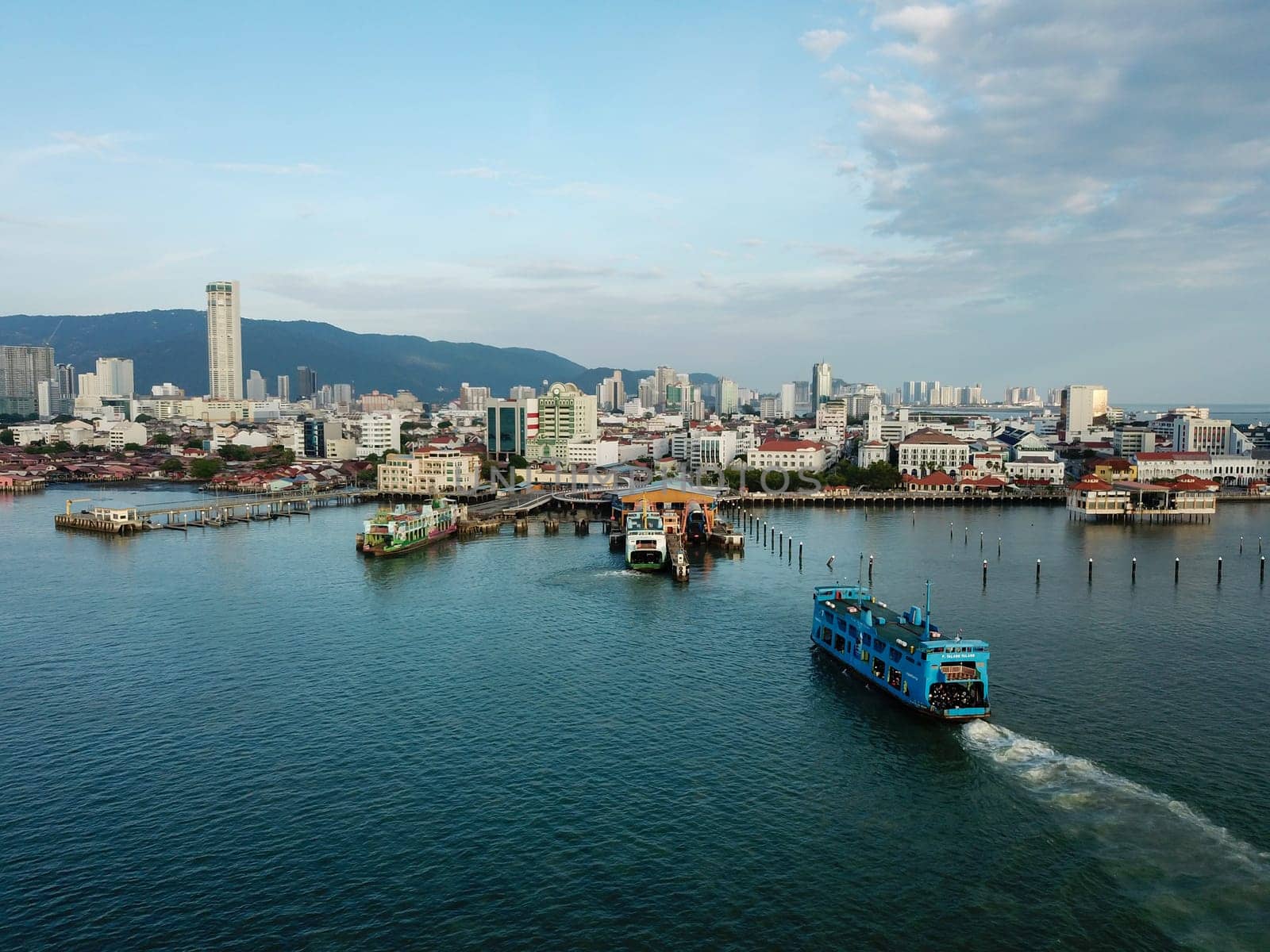 Georgetown, Penang/Malaysia - Feb 28 2020: Blue ferry carry passenger move towards Georgetown.