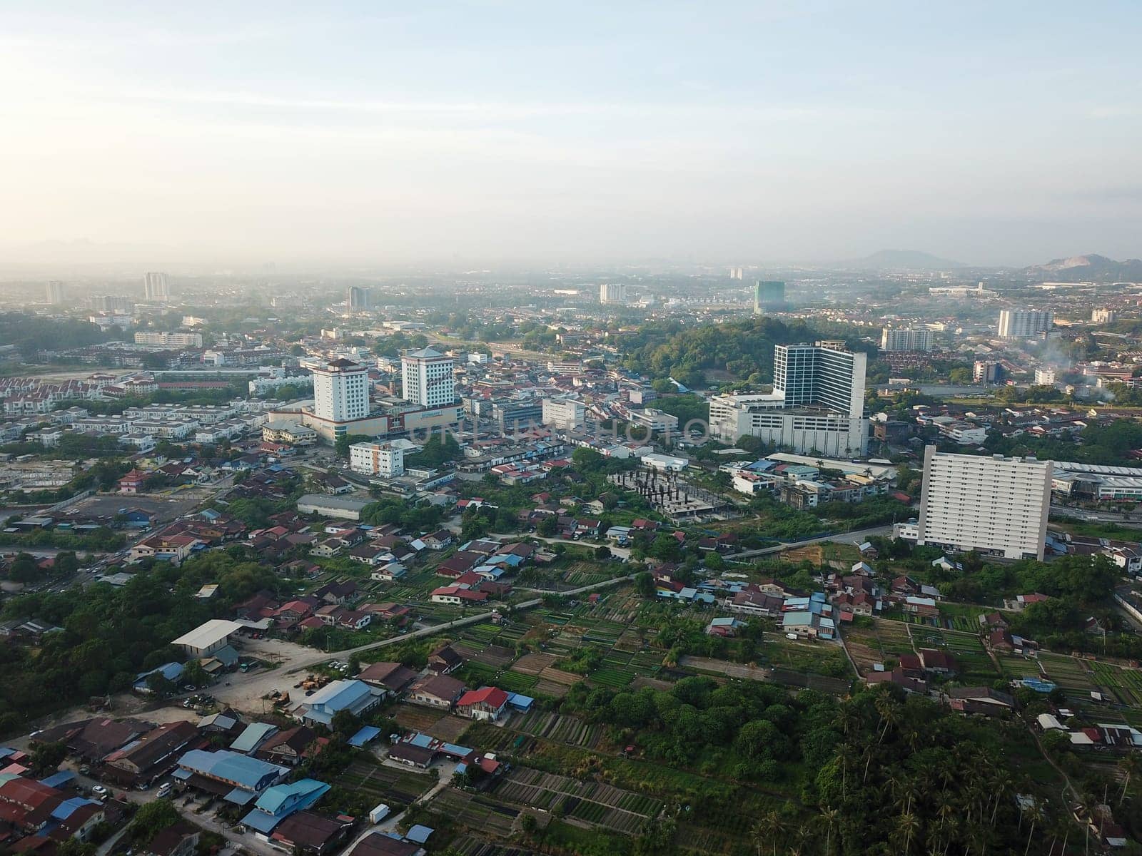 Bukit Mertajam, Penang/Malaysia - Feb 27 2020: Aerial view BM Plaza and rural area of vegetable plantation.