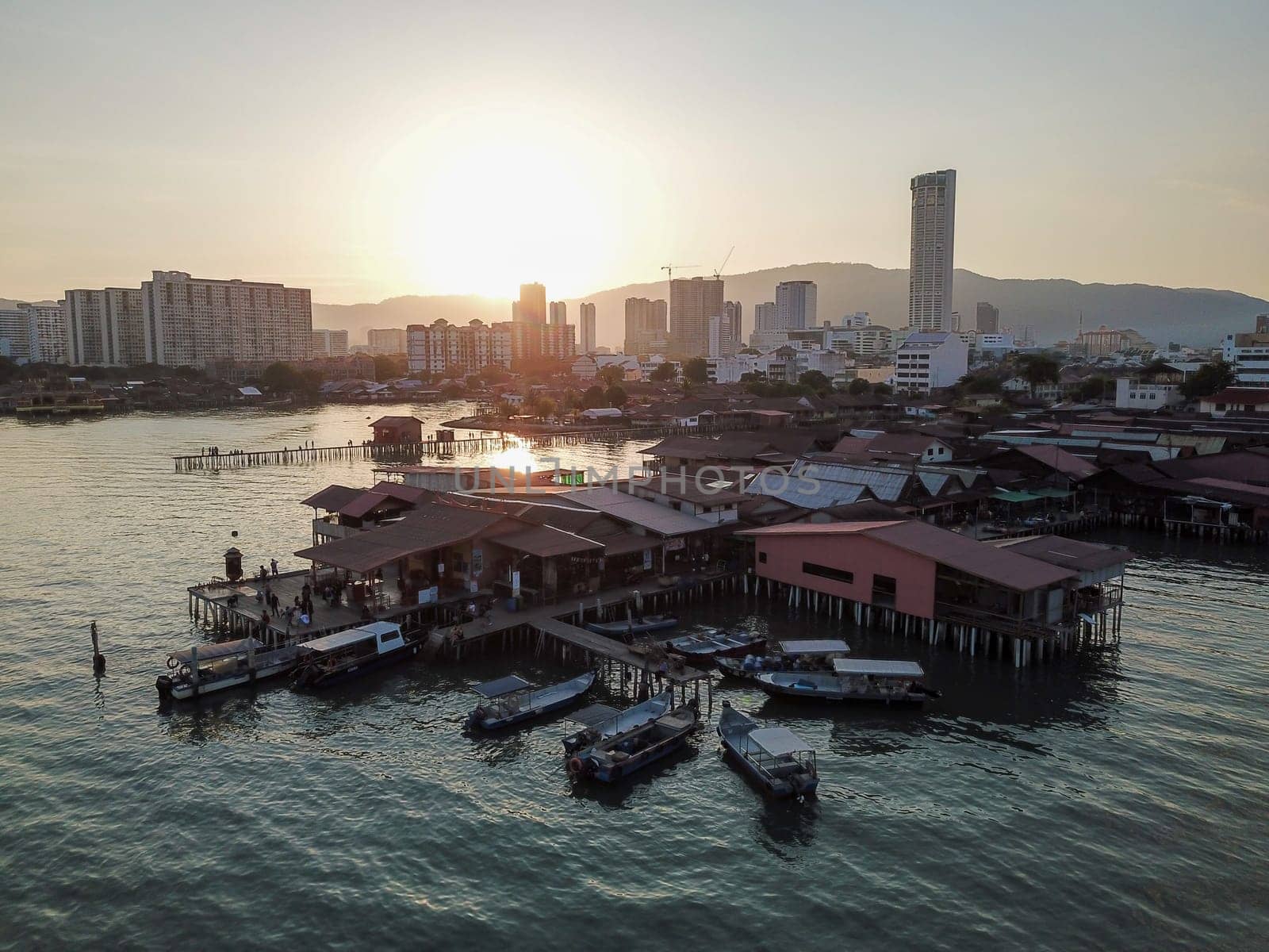 Georgetown, Penang/Malaysia - Feb 28 2020: Aerial heritage Chinese Settlements with wooden stilt house at sea.
