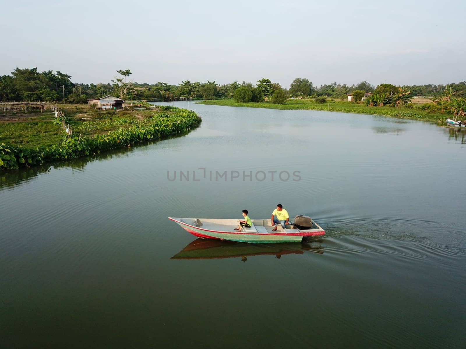 Local Malays family go to fishing with boat at Kampung Terus.
