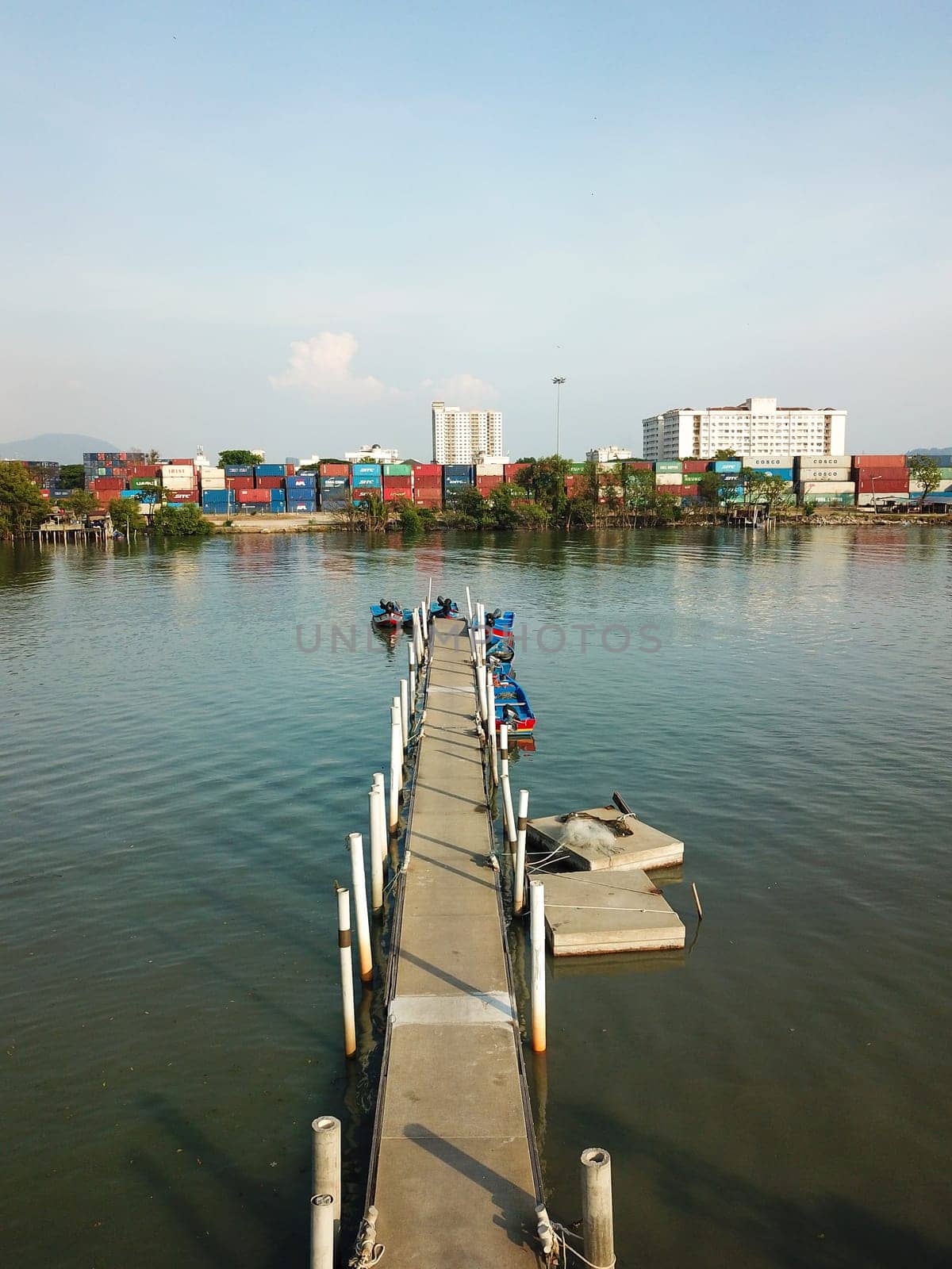 Perai, Penang/Malaysia - Mar 02 2020: Jetty at Bagan, Sungai Perai. Background is container depot.