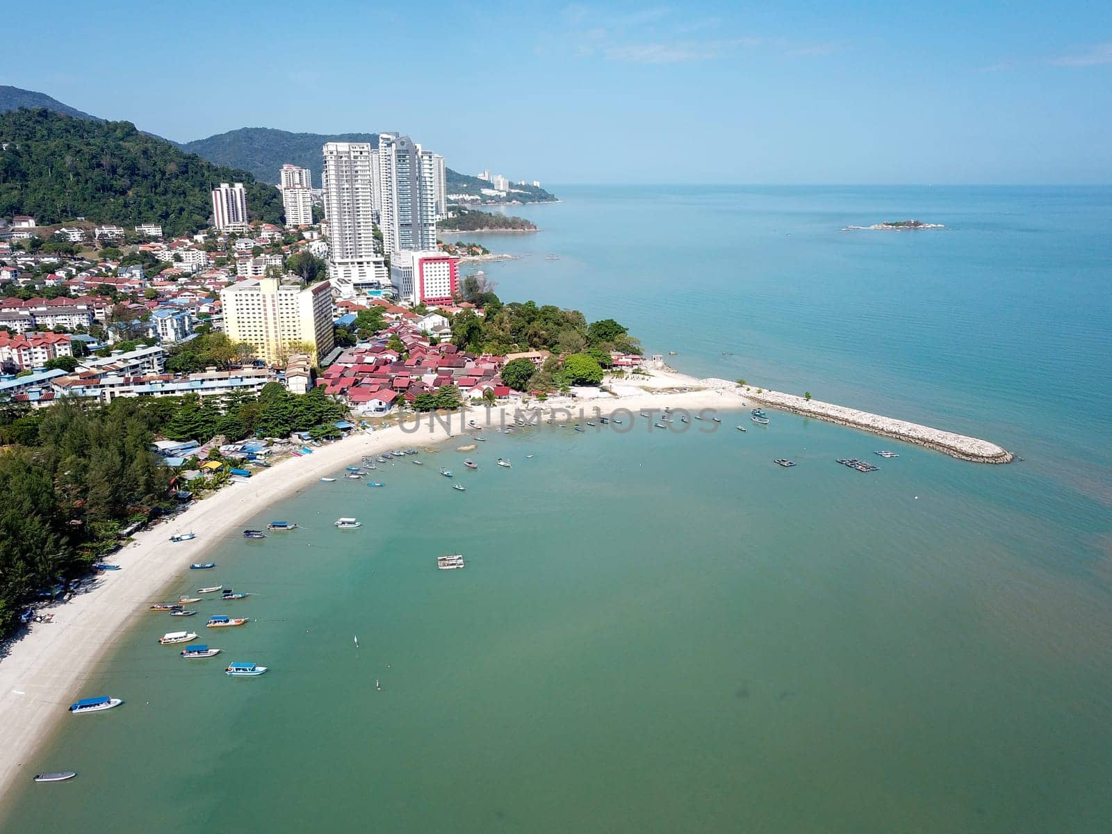 Georgetown, Penang/Malaysia - Feb 28 2020: Tanjung Tokong beach and fishing boats.