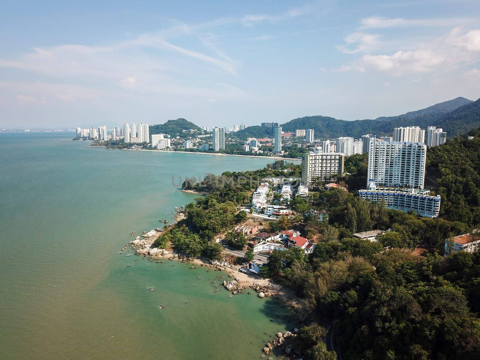 Batu Feringghi, Penang/Malaysia - Mar 08 2020: Aerial view Batu Feringghi condominium and sea.
