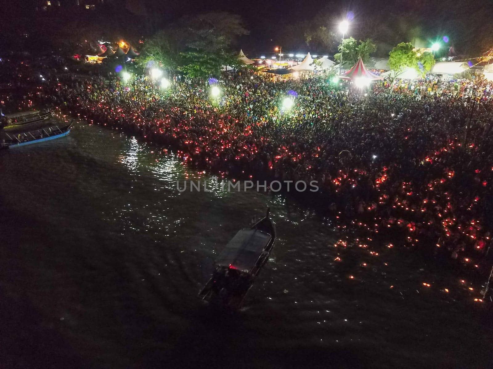 Teluk Bahang, Penang/Malaysia - Mar 08 2020: Thousand of devotees release lamp to sea during floating chariot festival