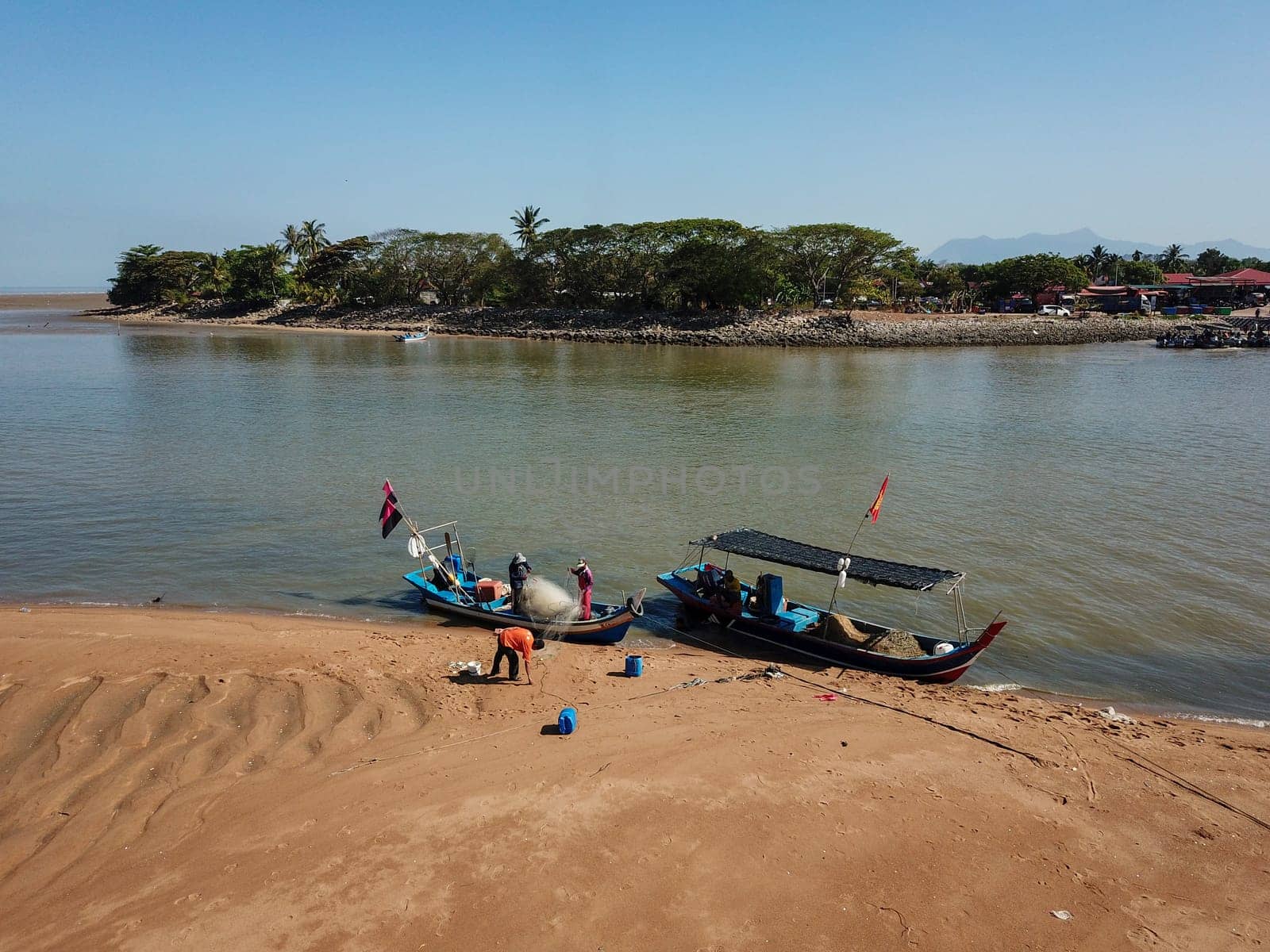 Penaga, Penang/Malaysia - Mar 14 2020: Fisherman clear fish net.