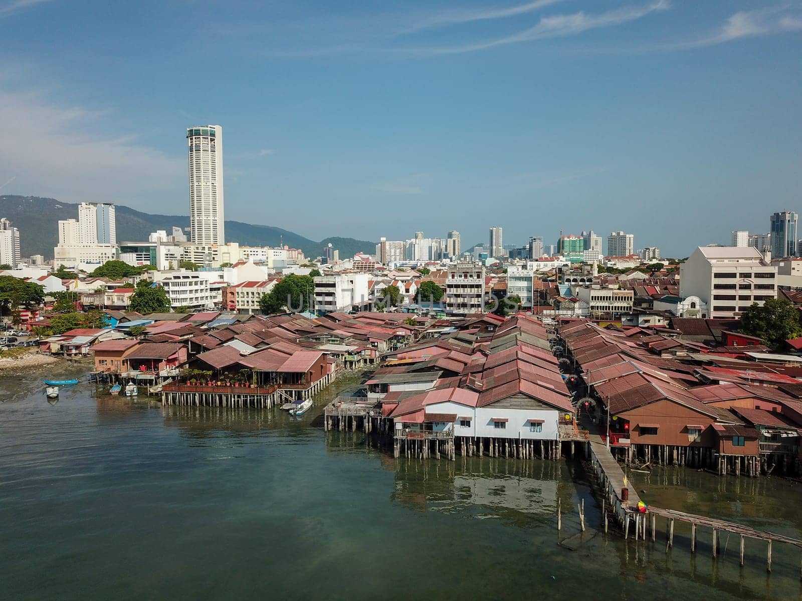 Aerial view rooftop at clan jetty in morning. Background is KOMTAR building.